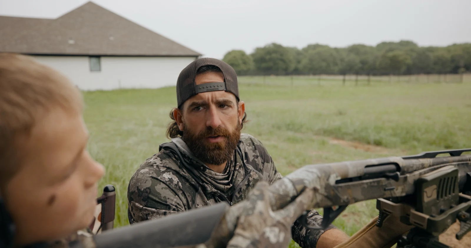 A father and son together during a first turkey hunt
